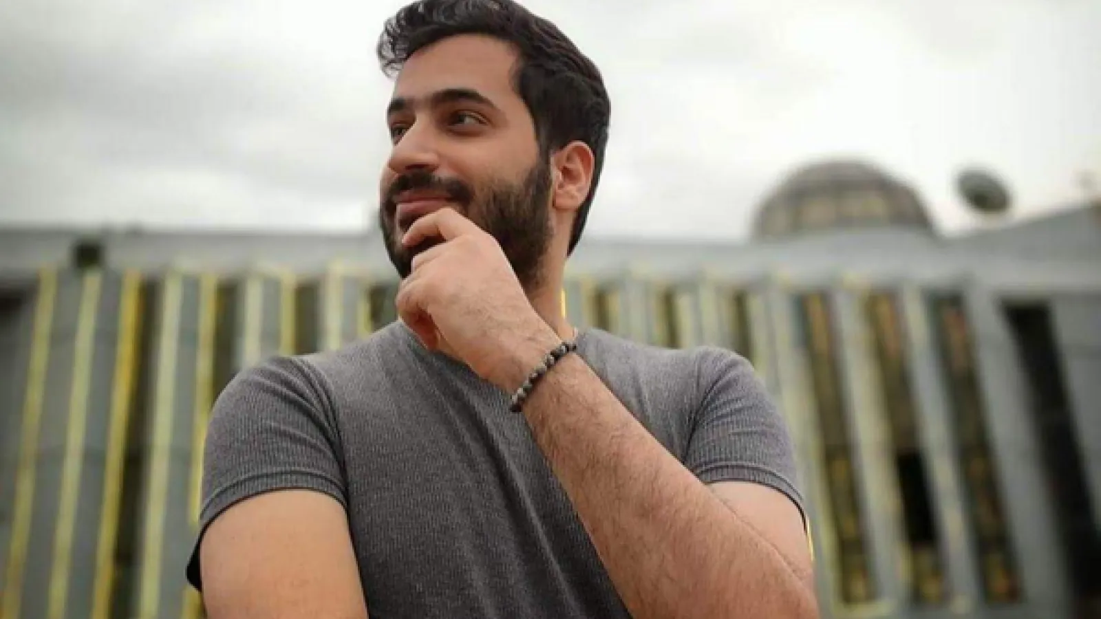 A Palestinian Man smiling and wearing a tshirt